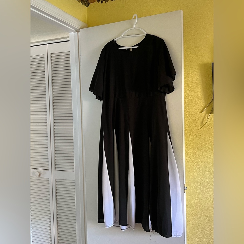 Black chiffon like dress with white inset pleats
